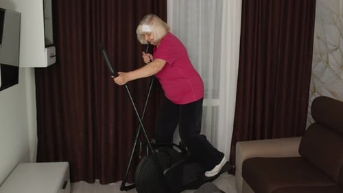 Seniors Exercising at Home Together