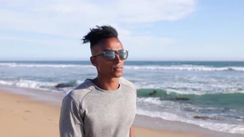 Mature Man Walking At The Beach