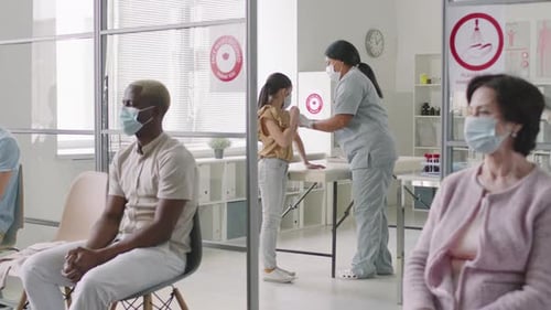 Busy Hospital Waiting Room with Medical Staff