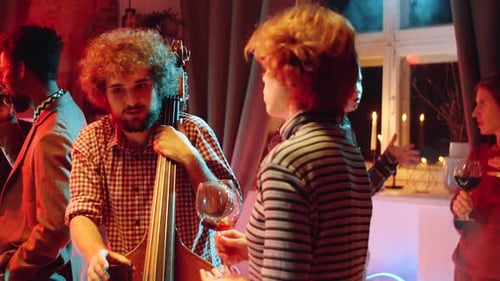 Festive Gathering with Music and Drinks