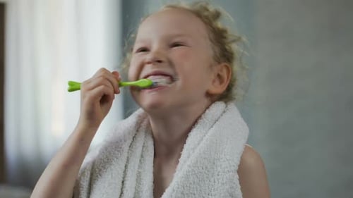 Little Girl Brushing Her Teeth Diligently, Dental Hygiene, Morning Ritual