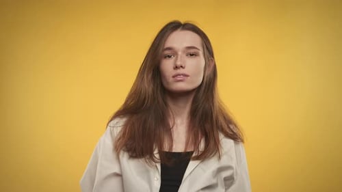 Fashionable Woman Posing Against Yellow Background