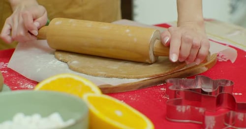 Rolling Out Sugar Cookie Dough To Bake Christmas Cookies.
