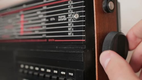 Front Glass and Tuning Knob of the Old Radio Tuning the Radio Wave