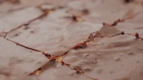 Chocolate glazed and cracked cake surface close-up 4K 2160p 30fps UltraHD footage - Tasty looking