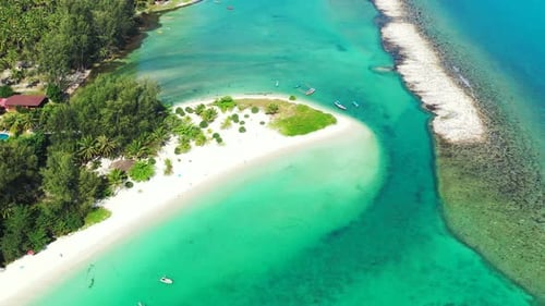 Wide angle flying tourism shot of a summer white paradise sand beach and blue sea background in colo