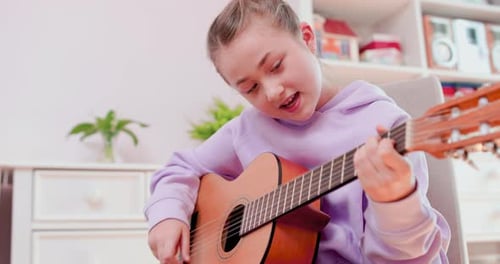 Girl Plays Guitar and Sings