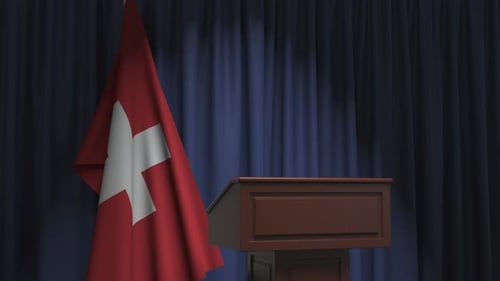 Corporate Event Podium with Waving Swiss Flag and Blue Curtains