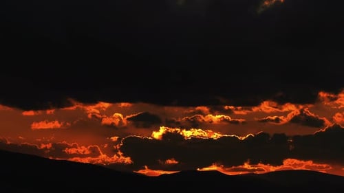 Dramatic Golden Sunset Over Mountainous Landscape