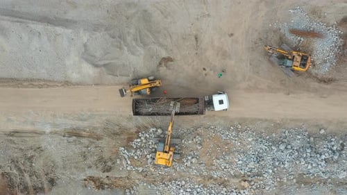 Aerial Shot of Heavy Machinery on Construction Site or Quarry