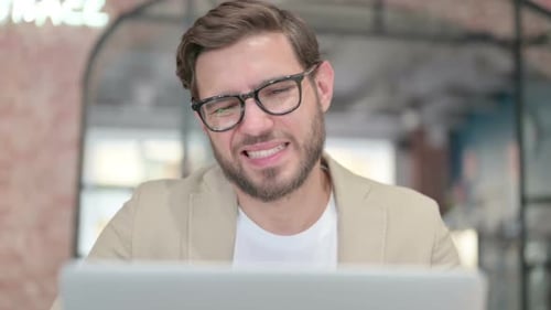 Close Up of Man with Laptop Having Neck Pain
