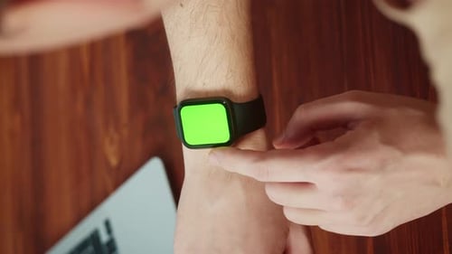 Vertical Video of Man Student Using Smartwatch with Chroma Key Closeup