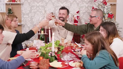 Family Toasting Christmas Dinner at Home
