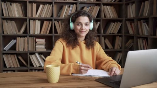 Cheerful Student with Laptop Studying at Home