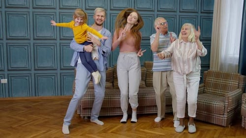 Happy Family Dancing Together Indoors