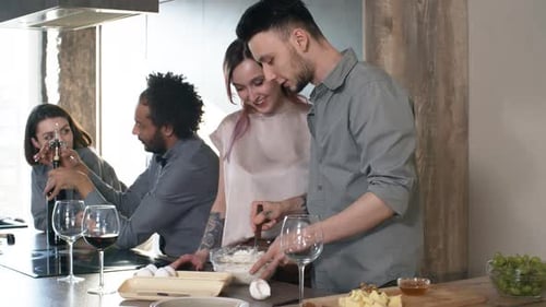 Friends Cooking Together in Modern Kitchen