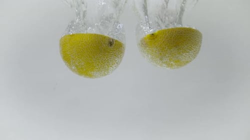 Sliced Yellow Melon Falling Into Water