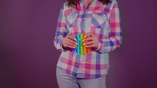 Close Up of Unrecognizable Person Playing with Pop It