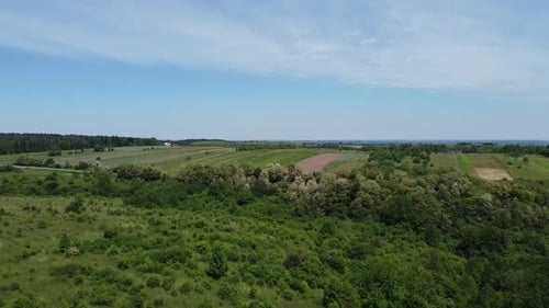 Aerial drone view of a flying over the rural agricultural landscape.