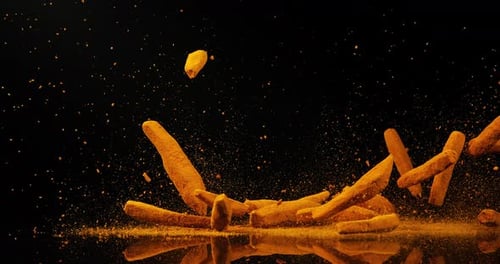 Turmeric, curcuma longa, Roots falling against Black Background, Indian Spice, Slow Motion 4K
