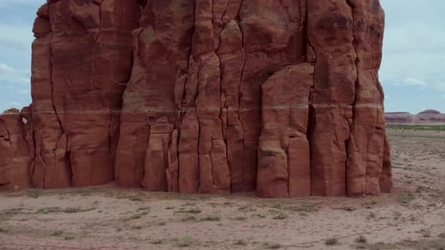 Geological Layers of Sandstone Rock in Standing Cliff Rock Formation in Arizona Desert - Aerial Pull