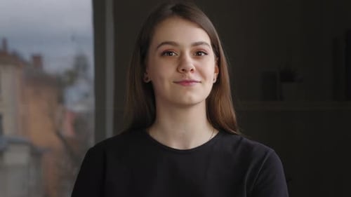 Young Woman Clapping Her Hands Indoors