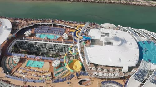 Aerial Drone View of White Ship with Entertainment Center on the Upper Deck