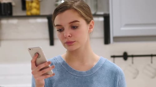 Woman Using on Smartphone for Browsing Email and Messages