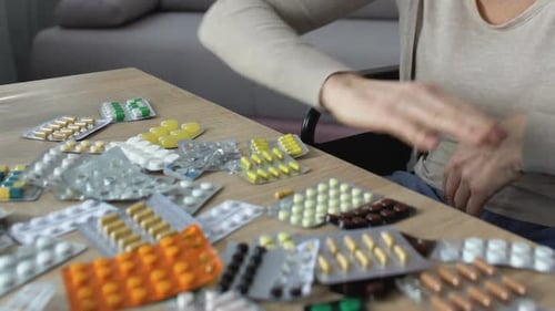 Lonely Ill Woman Throwing Away Medicines, Feeling Desperate of Incurable Disease