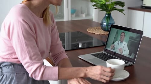 Woman at Home Telehealth Consultation with Doctor