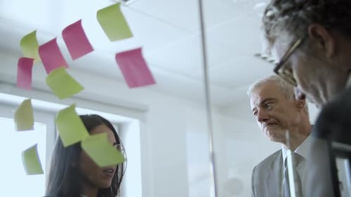 Colleagues Brainstorming Ideas in Modern Office