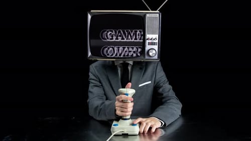 Man with TV Head Plays Retro Video Game