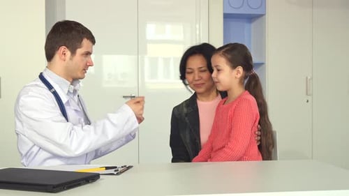 Doctor Checks Up Little Girl at the Office