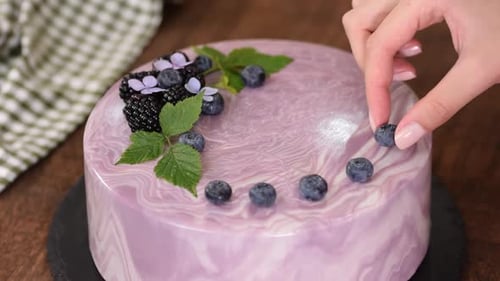 Decorating a Delicious Cake with Fresh Blueberries