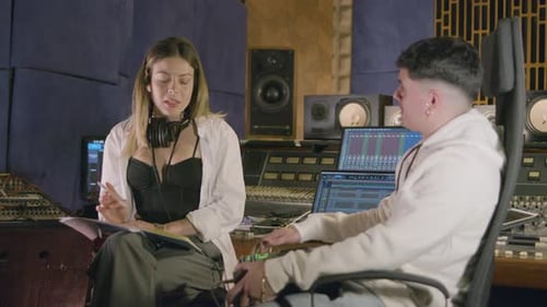 Two Talented Musicians Working at Music Recording Studio