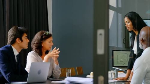 Business Professionals Brainstorming in Modern Conference Room