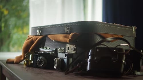 Vintage Suitcase and Cameras Ready for Adventure