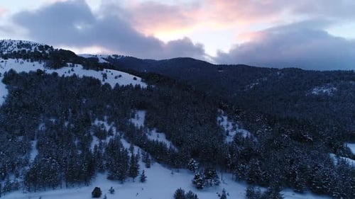 Snowy Mountain Range at Sunset Aerial View