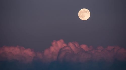 Dramatic Full Moon with Clouds in the Night Sky