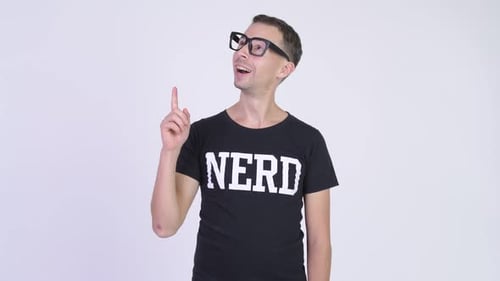 Studio Shot of Happy Nerd Man Thinking While Pointing Up