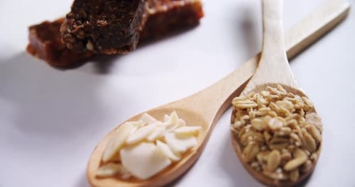 Granola bars with cereals in spoon ready for breakfast 4k