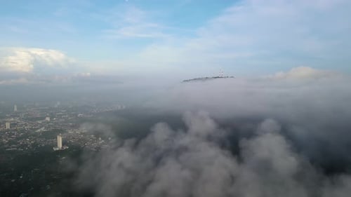 Aerial view move over foggy cloud at forest