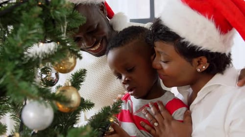Family Decorating Christmas Tree With Love and Cheer