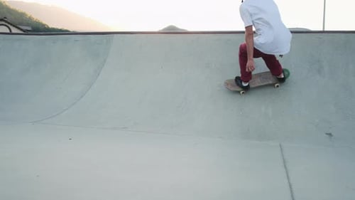 Young Adult Skateboarding in Skatepark