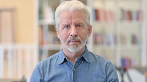 Portrait of Older Man Looking at Camera
