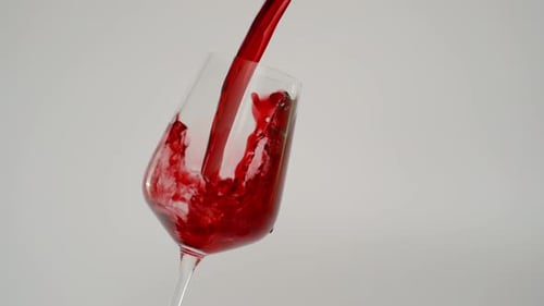 Slow Motion of Red Wine Pouring in Glass, 1000 fps