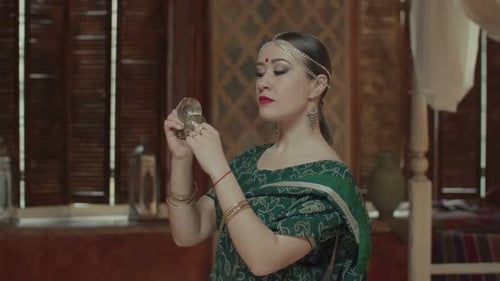 Indian Woman Poses Gracefully With Cymbals