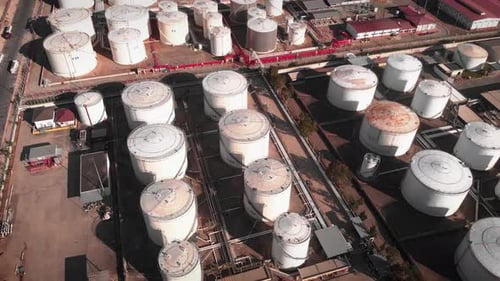 Gas tanks and refinery equipment. Huge white oil and fuel tanks reservoirs at refinery plant.