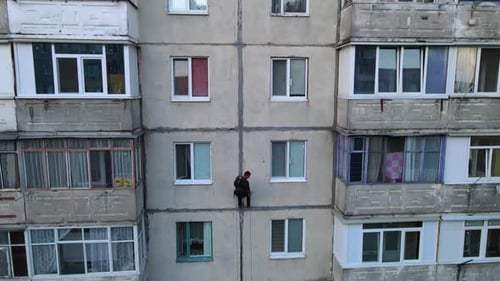 Climber Go Down To Land After Work on Construction Site of a High-rise Building. Dangerous Work in