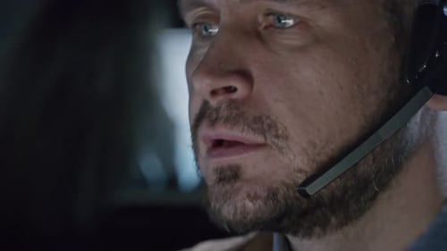 Man Wearing Headset Speaking in Office